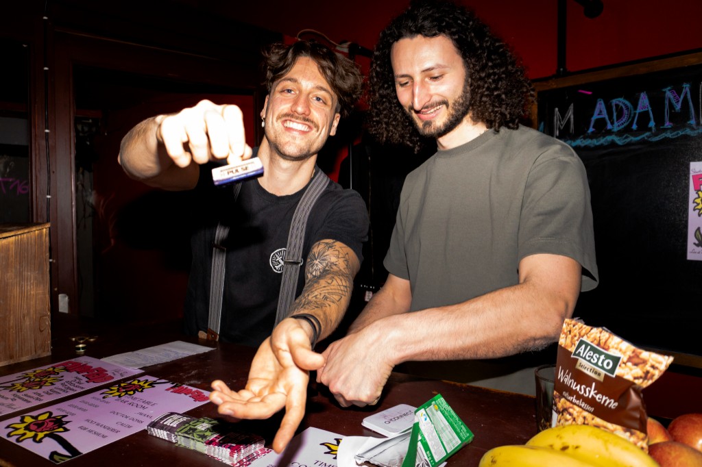 Pulse Friction merch table at an event with flyers and friends