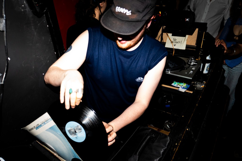 DJ pulling vinyl at the booth