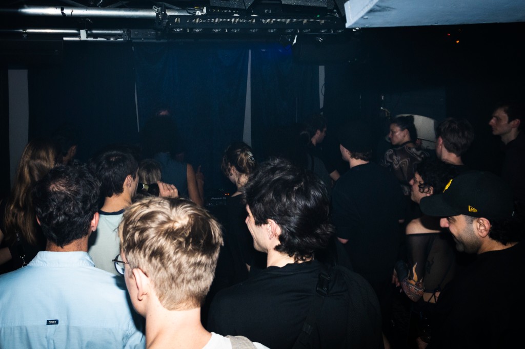 Crowd around the mixer in the dark